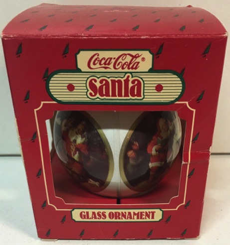 45164-2 € 6,00 coca cola kerstbal glas 2x afbeelding kerstman ( met verschilende doosjes)